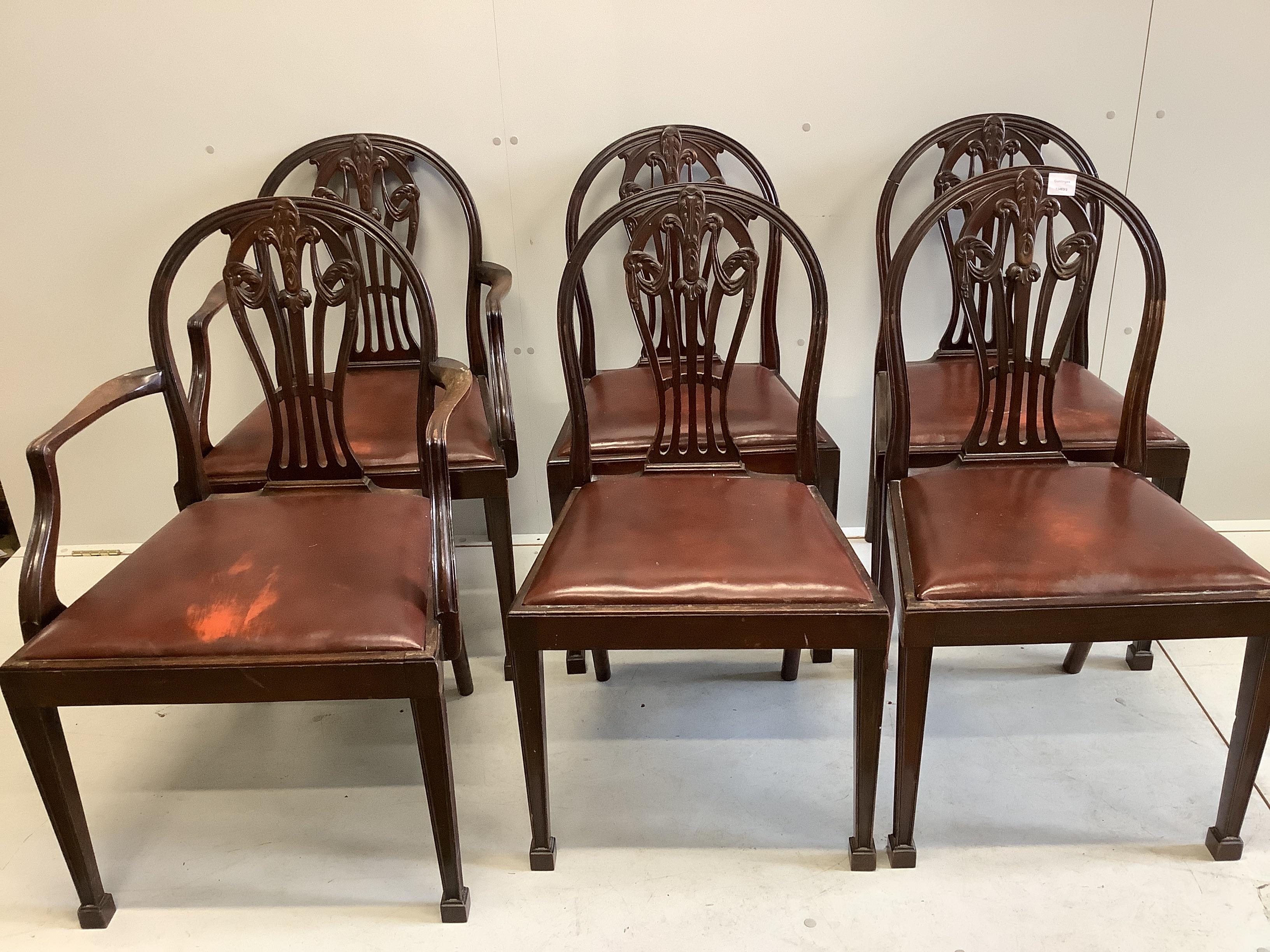 A set of six Hepplewhite style mahogany dining chairs, two with arms